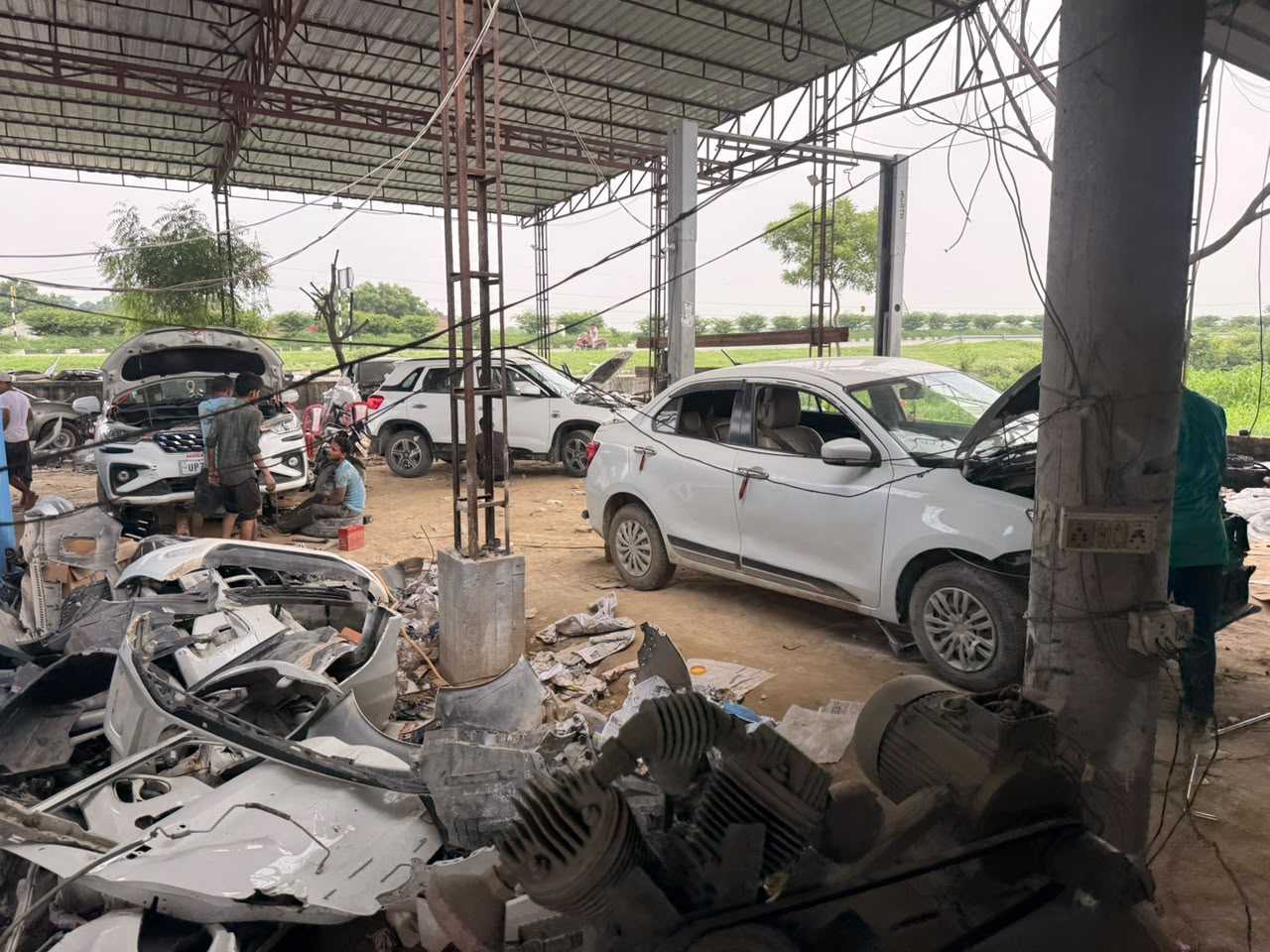 Mechanic servicing a car engine at Lucky Automobile Workshop Jaunpur